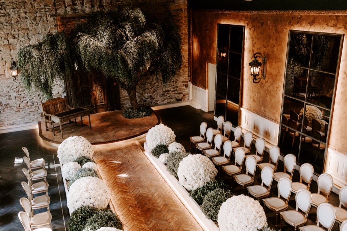 The ceremony room at The Croft set with white chairs